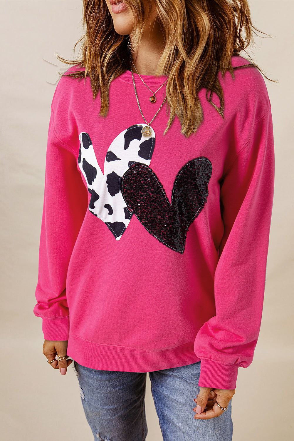 Pink cow print sweater